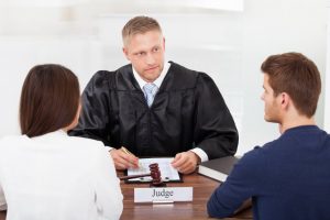 Couple talking with divorce judge