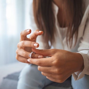 woman taking a ring off